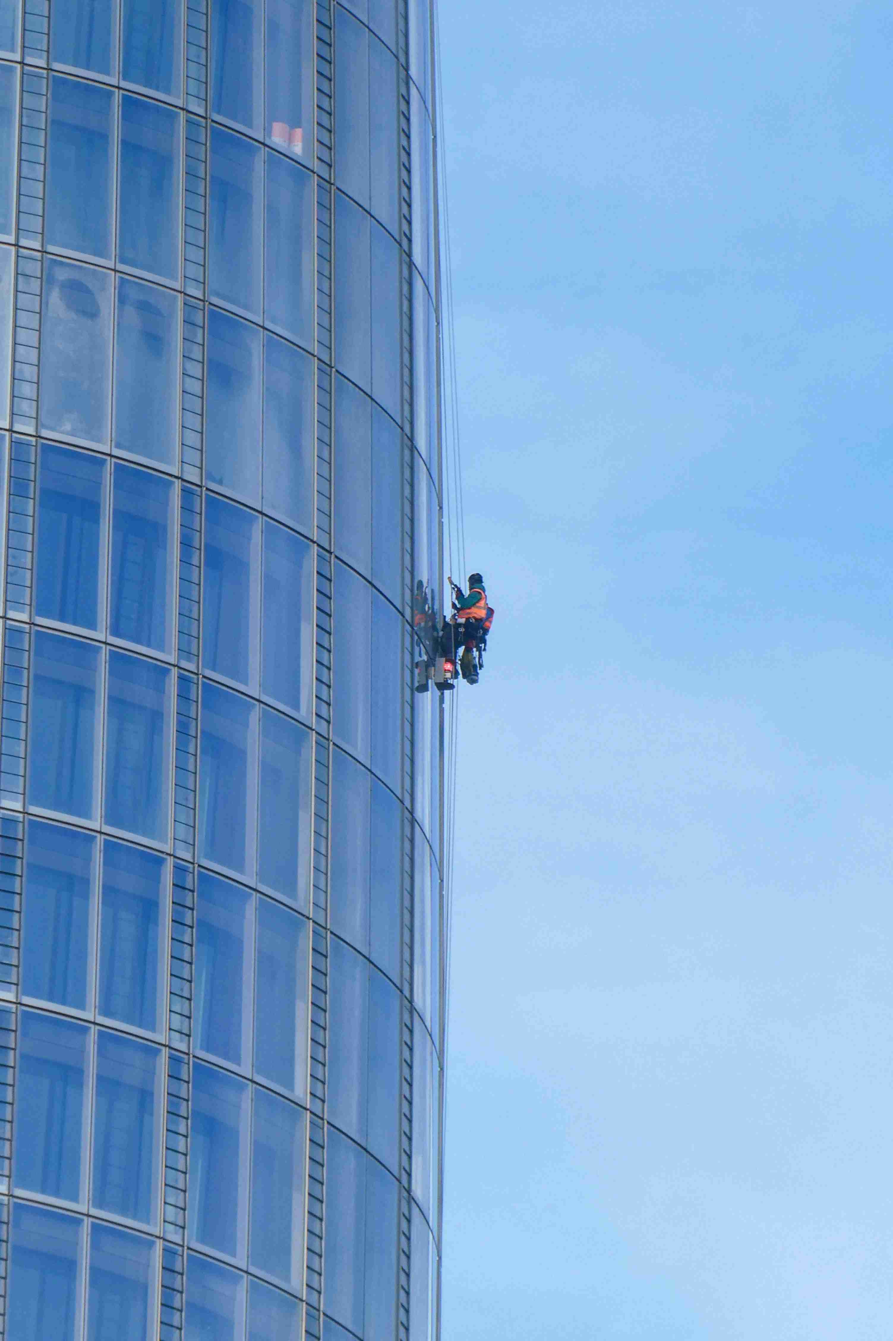 Abseiler working on high-rise building